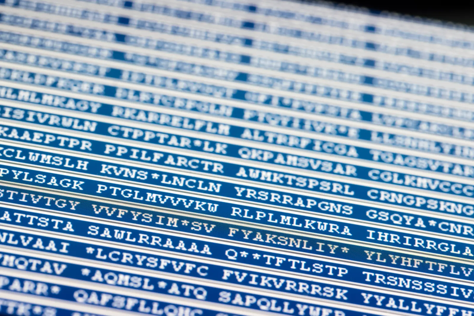 Close-up of a blue protein sequence printout tied to performance and recovery optimization